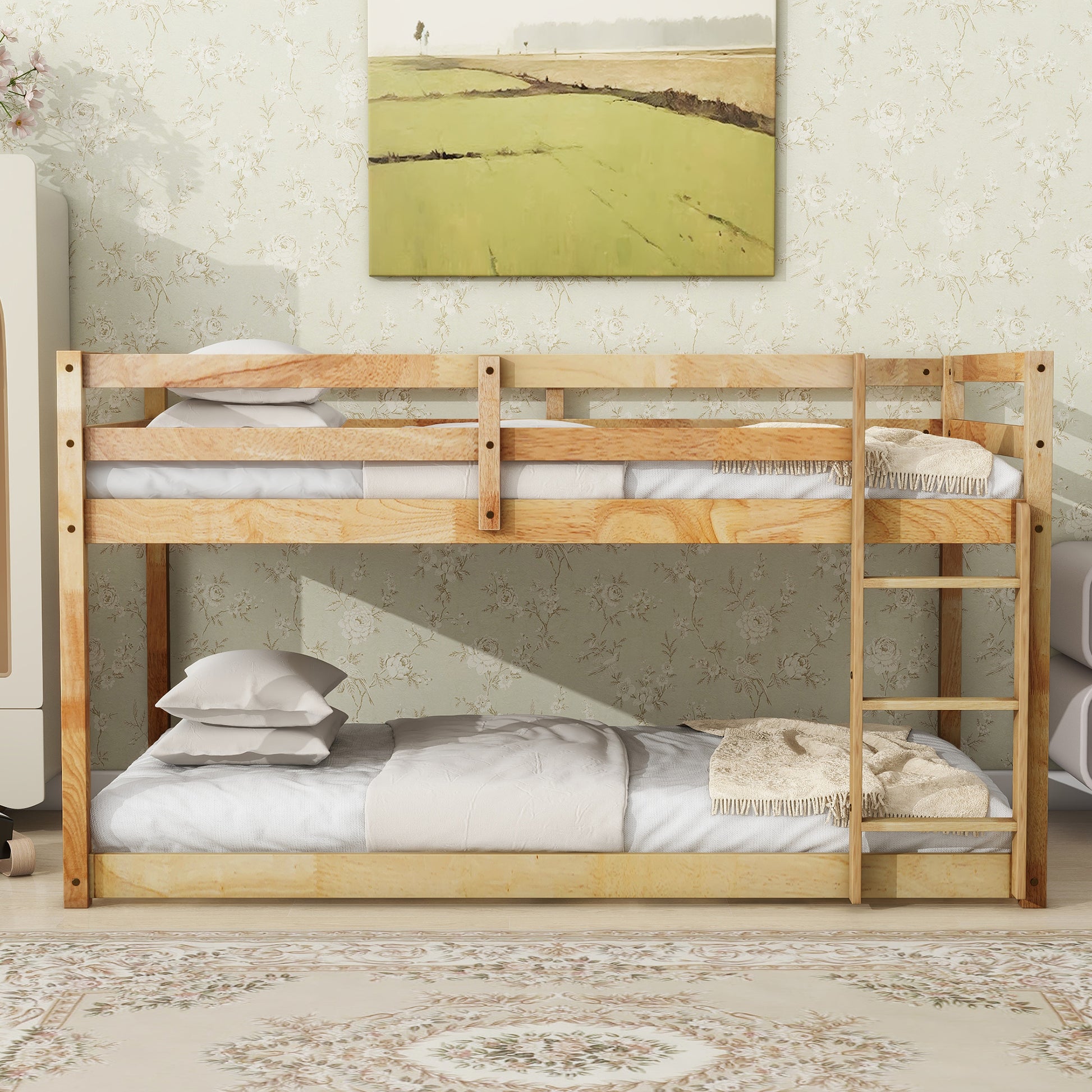 Natural pine wood bunk bed with white linens and a textured throw blanket