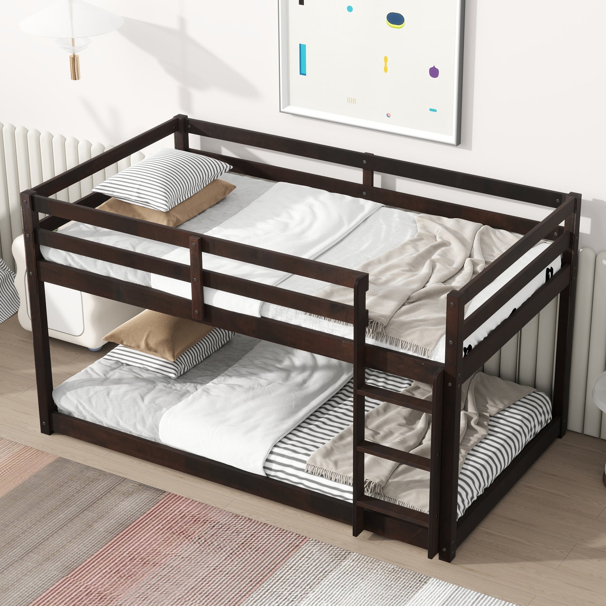 Dark wood bunk bed with twin mattresses and striped bedding