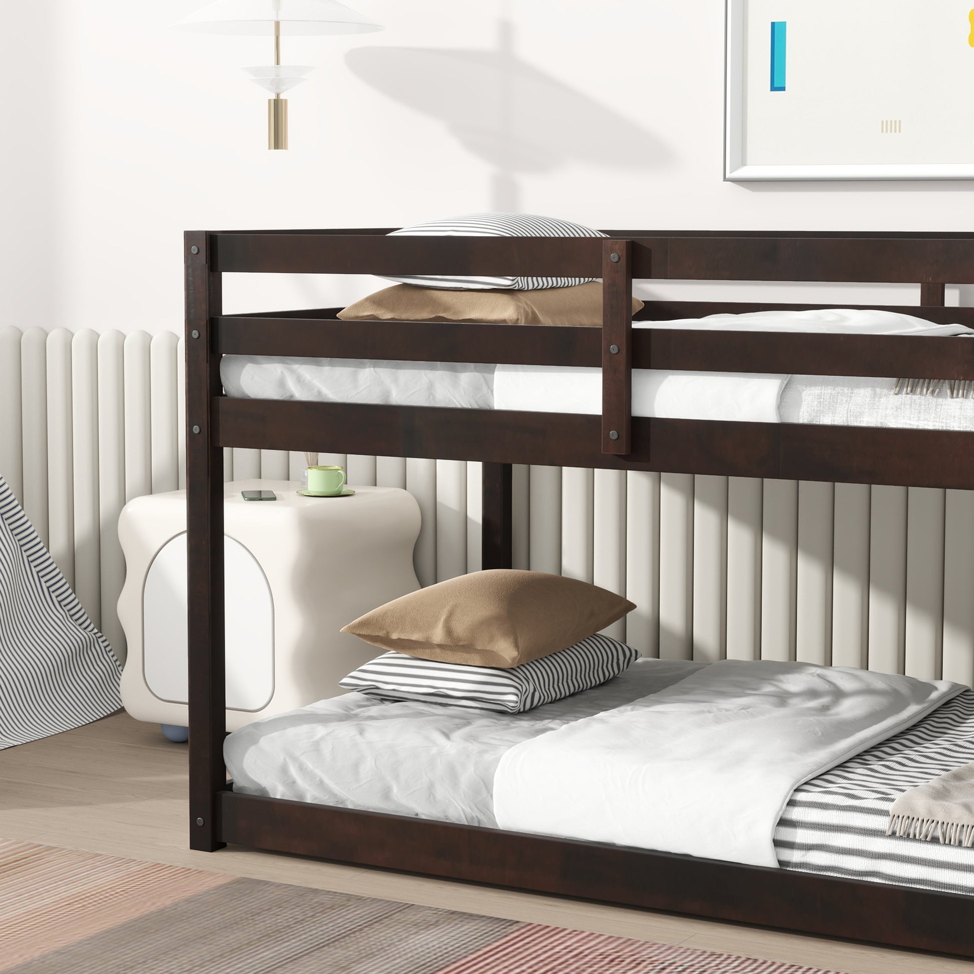 Dark brown wooden bunk bed with white bedding and striped pillows
