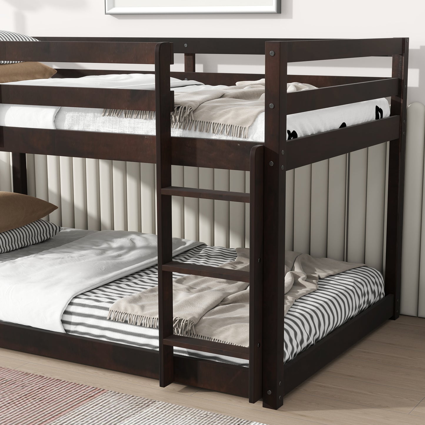 Dark wood bunk bed with white linens and striped blankets