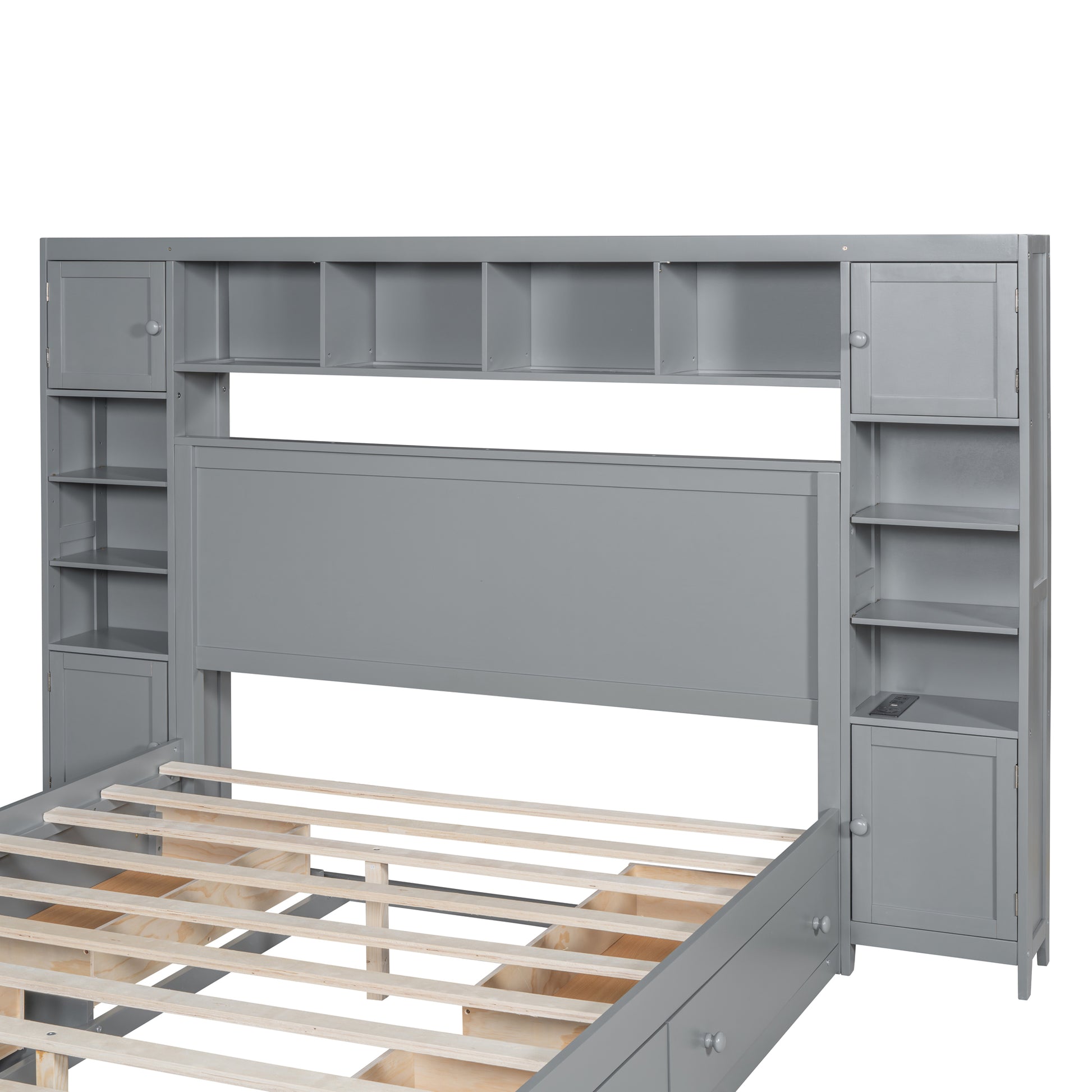 Gray wood storage bed frame with builtin headboard shelving and side cabinets