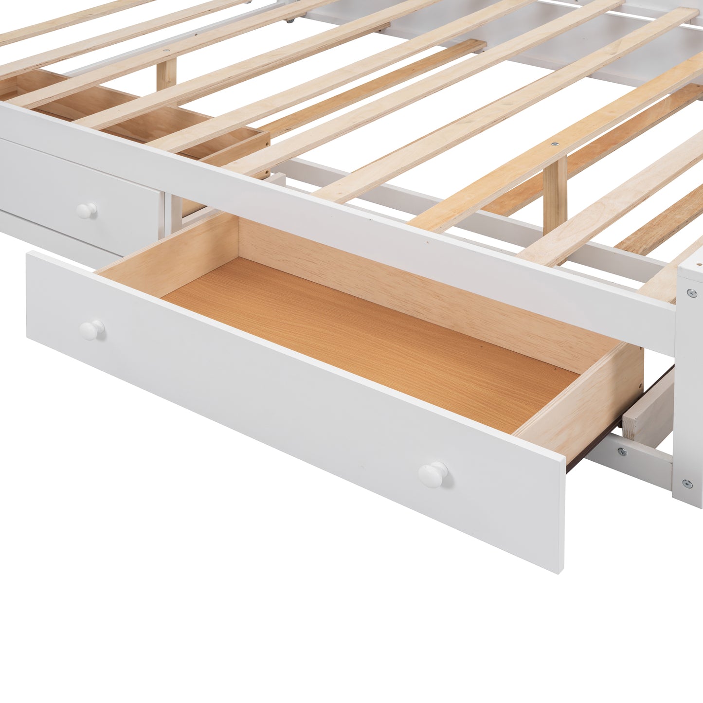 White wooden bed frame detail showing open drawer and slats