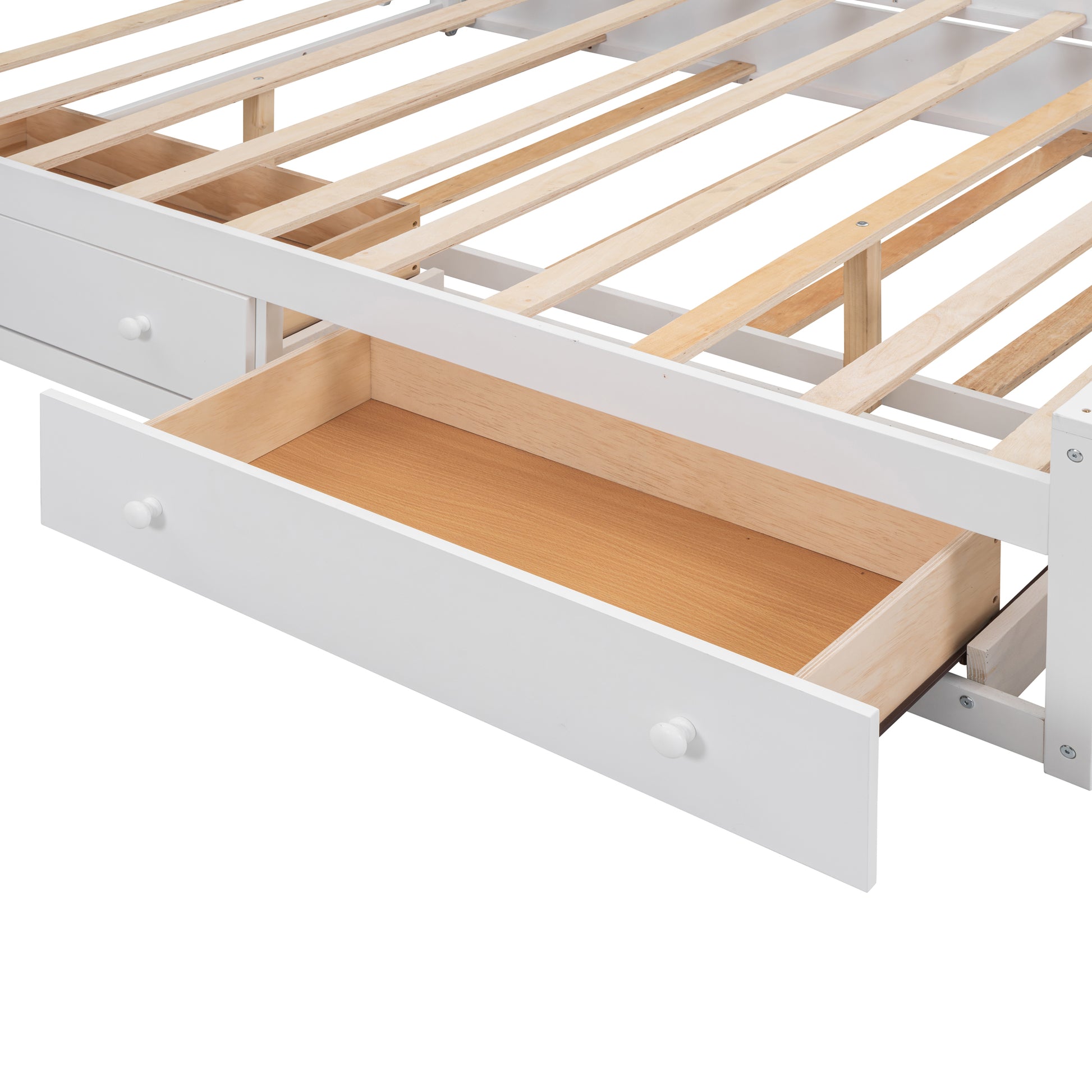 White wooden bed frame detail showing open drawer and slats