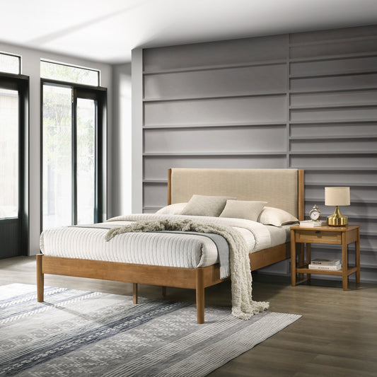 Wooden platform bed with upholstered headboard and textured white bedding
