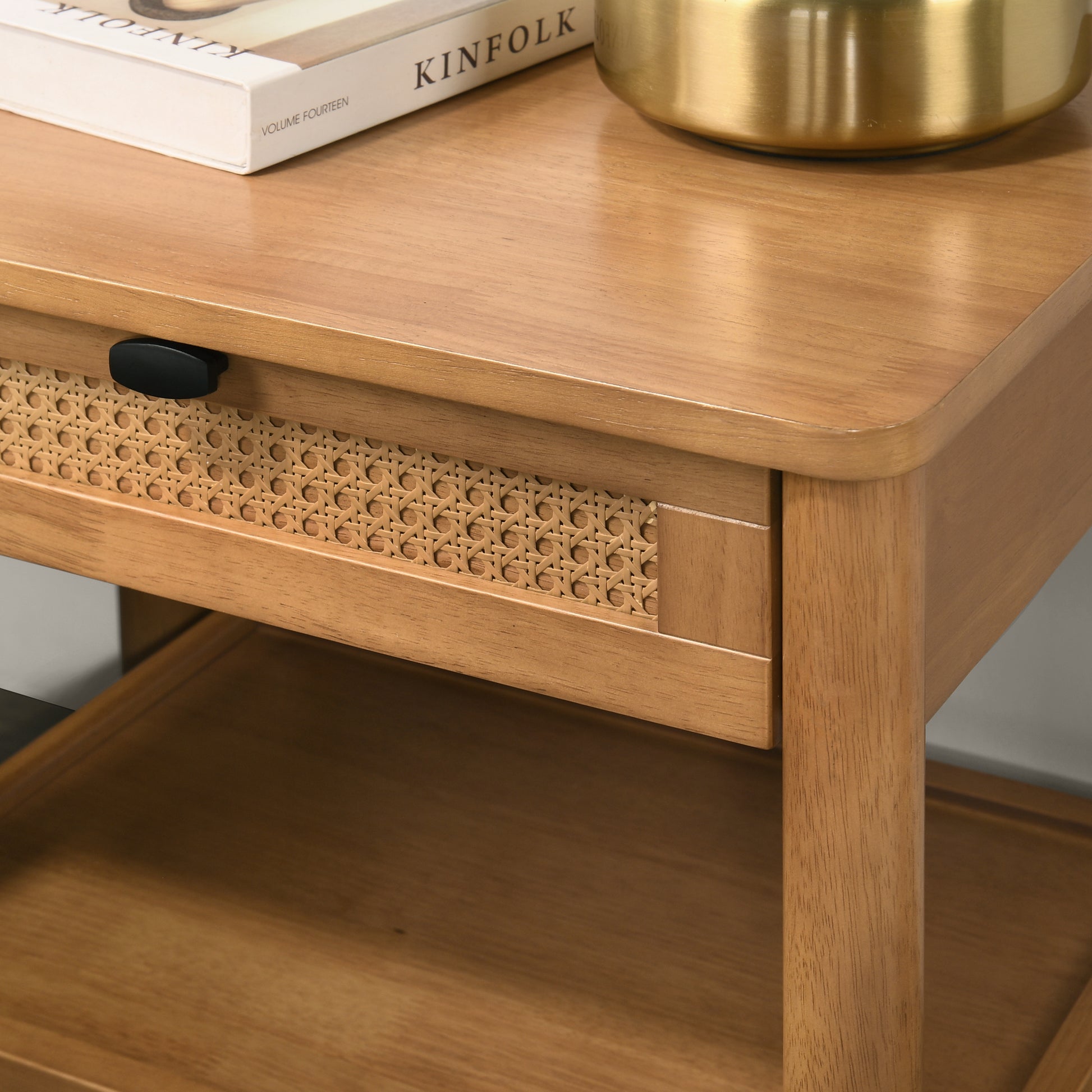 Natural wood nightstand with woven drawer front and black knob