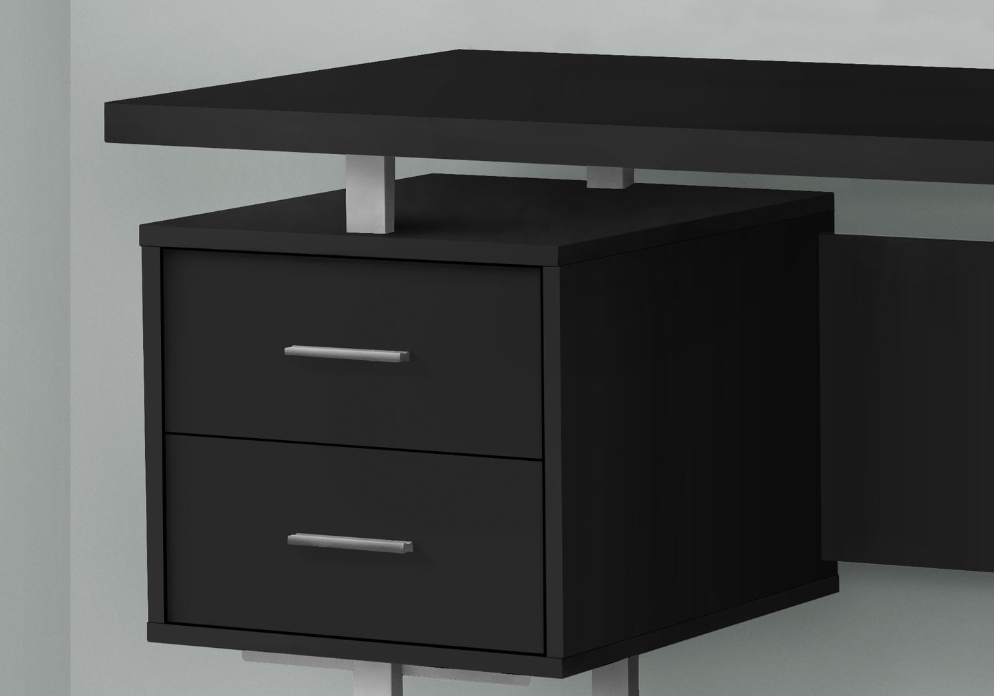 Sleek black modern desk with two drawers and silver handles for home office setup