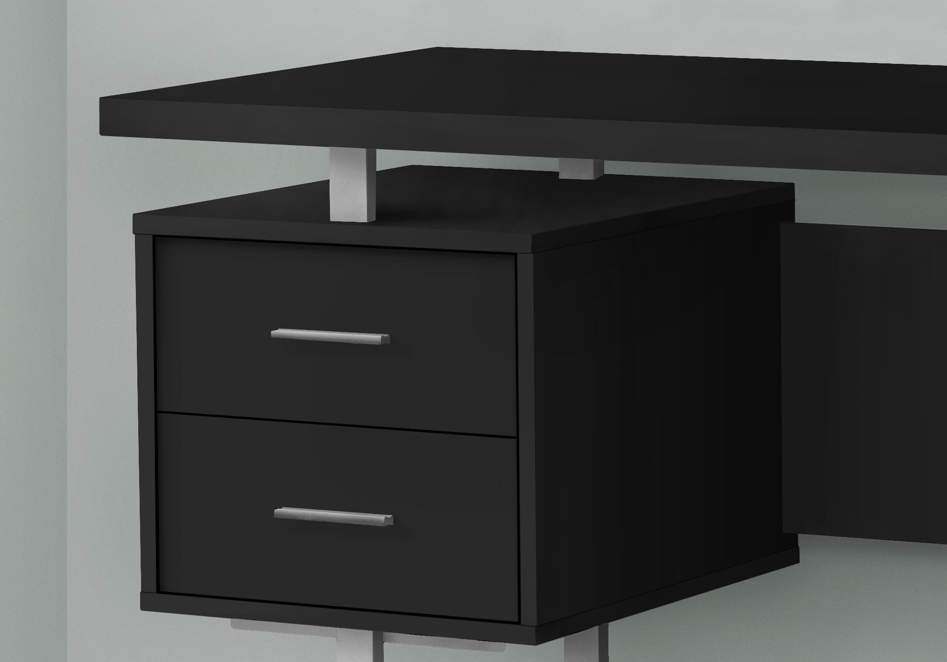 Sleek black modern desk with two drawers and silver handles for home office setup