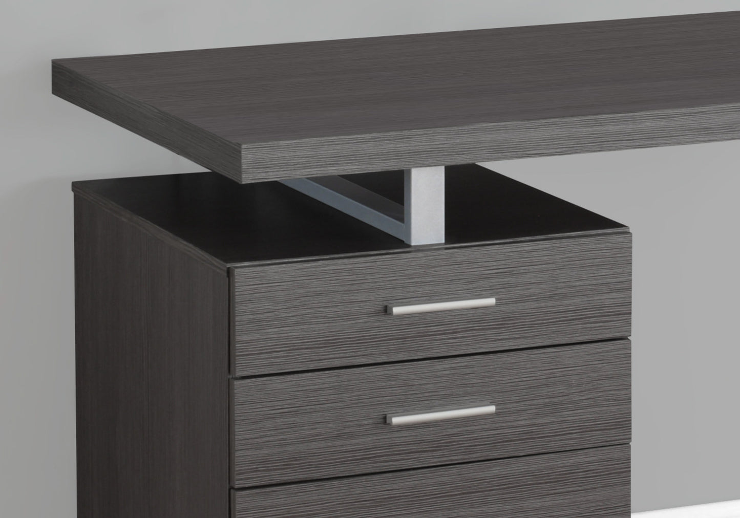 Modern dark gray desk with three drawers and a floating top perfect for home office