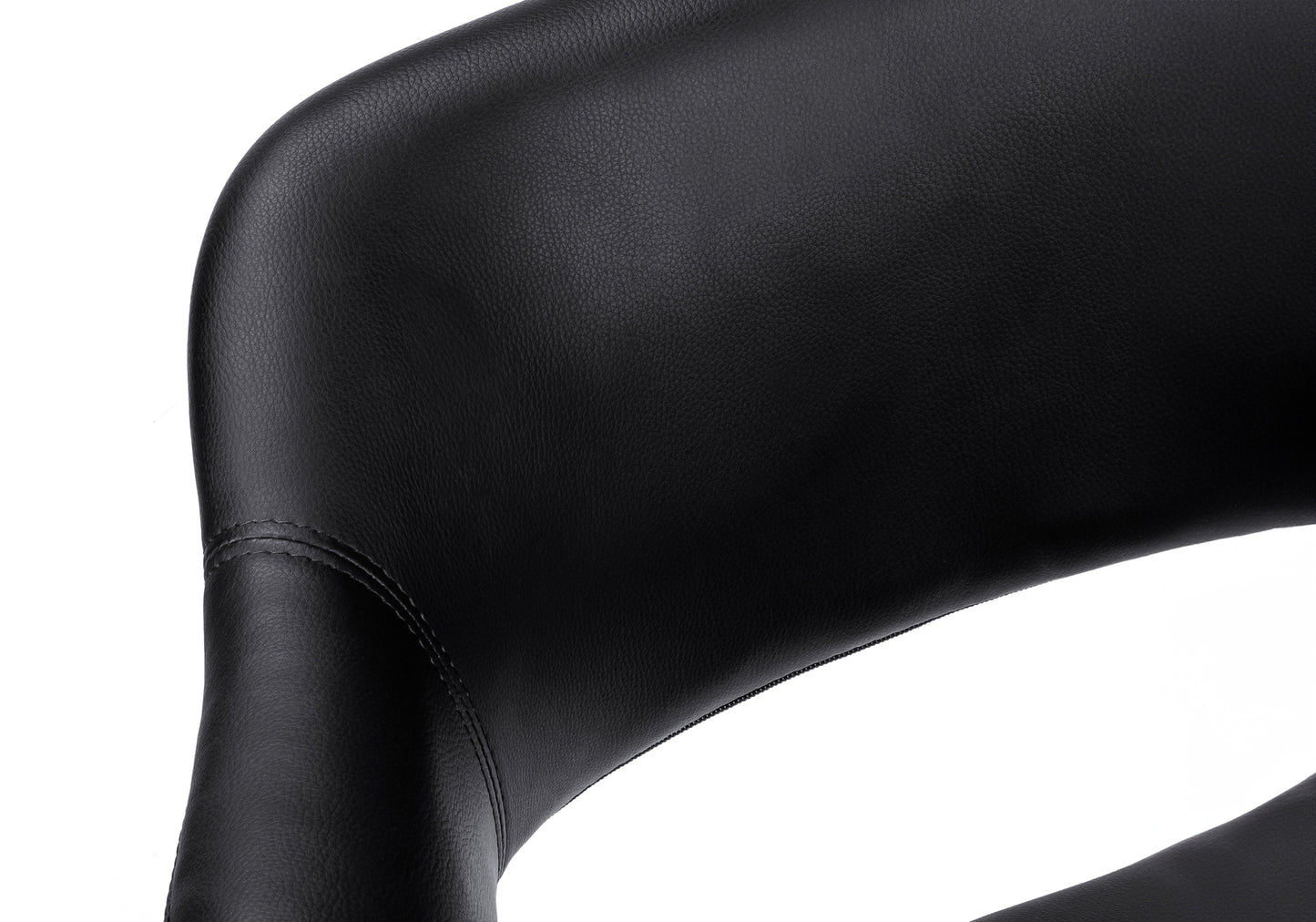 Closeup of black leather seat cushion with subtle texture for comfort