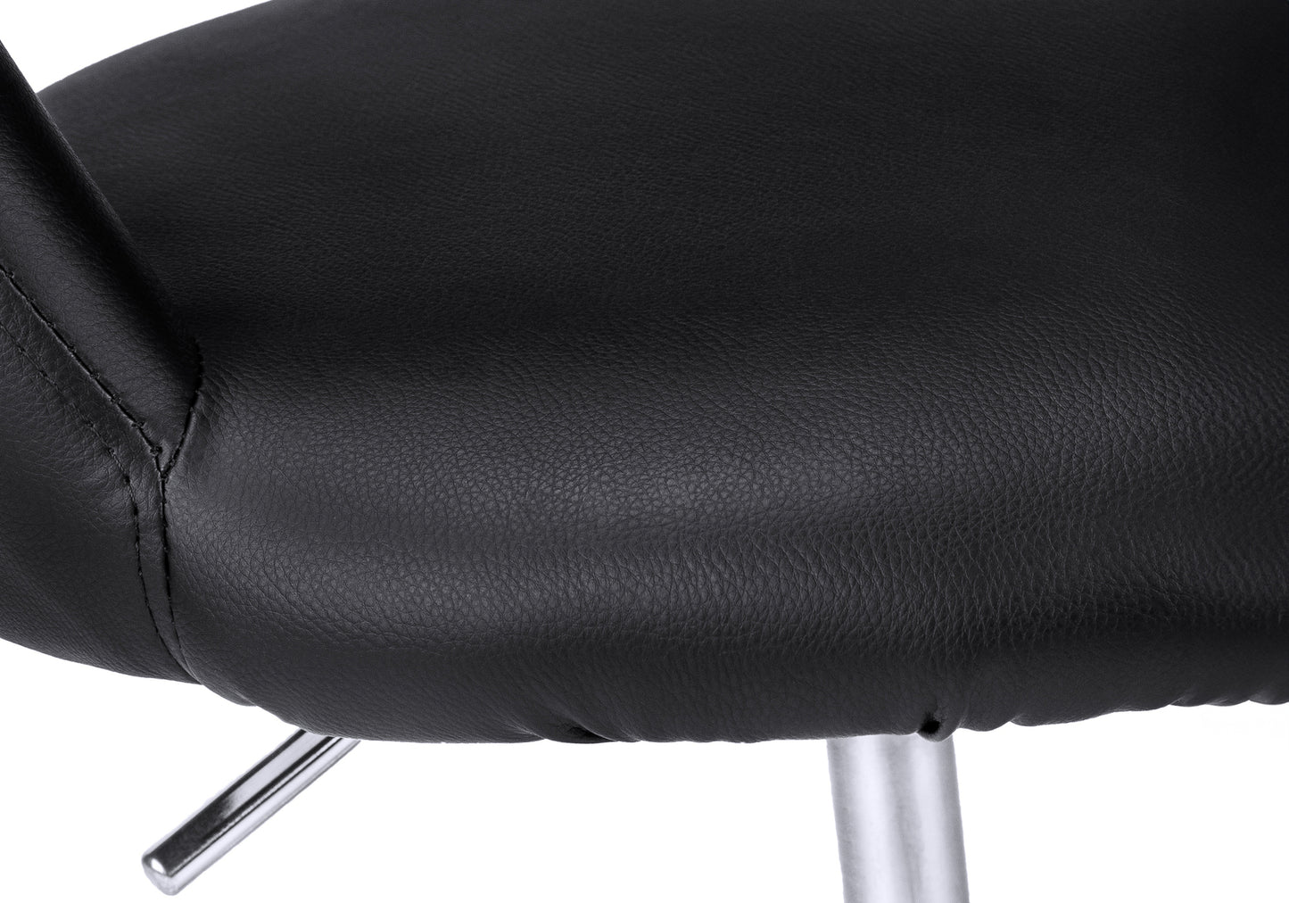 Closeup of black faux leather seat cushion with visible stitching and a chrome support leg ideal for modern home decor