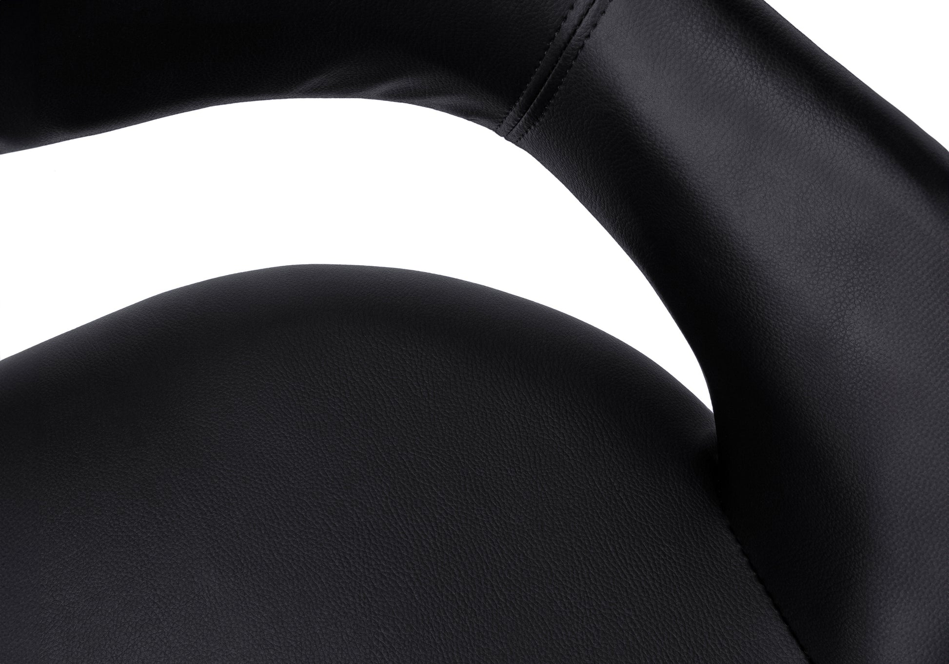 Closeup of black vegan leather chair armrest with visible stitching