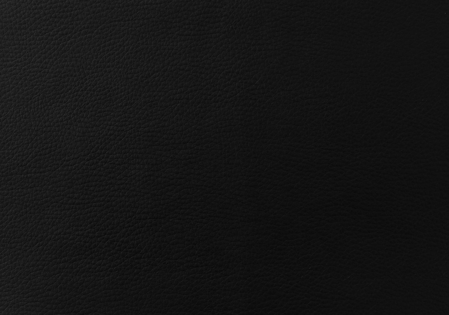 Closeup of textured black genuine leather material perfect for upholstery or fashion