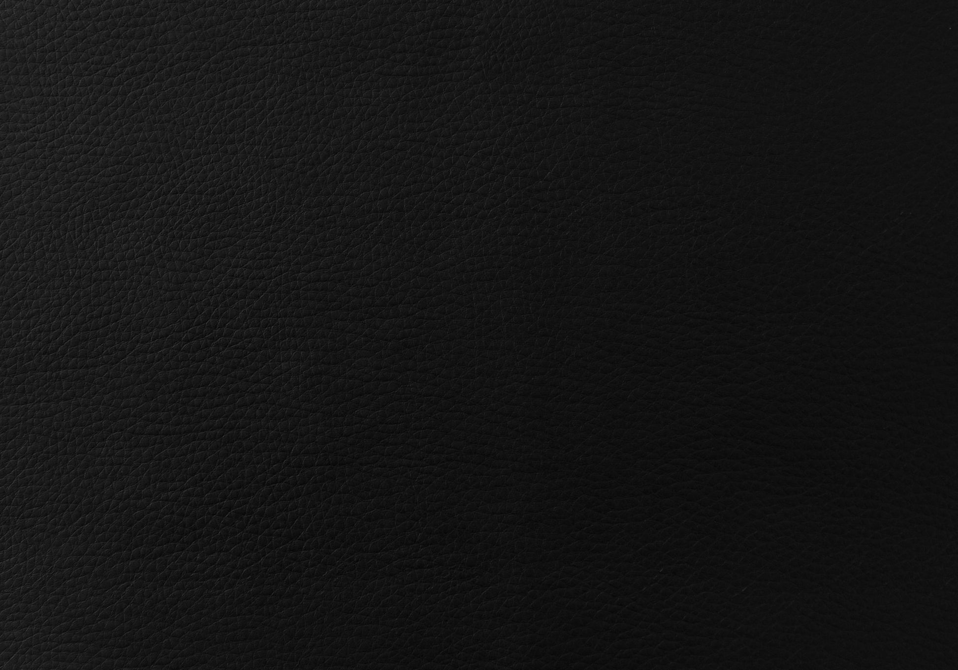 Closeup of textured black leather material ideal for upholstery