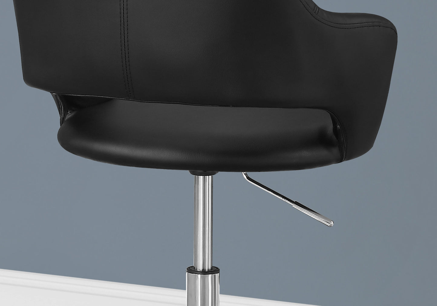 Black faux leather office chair seat with chrome lever and silver base