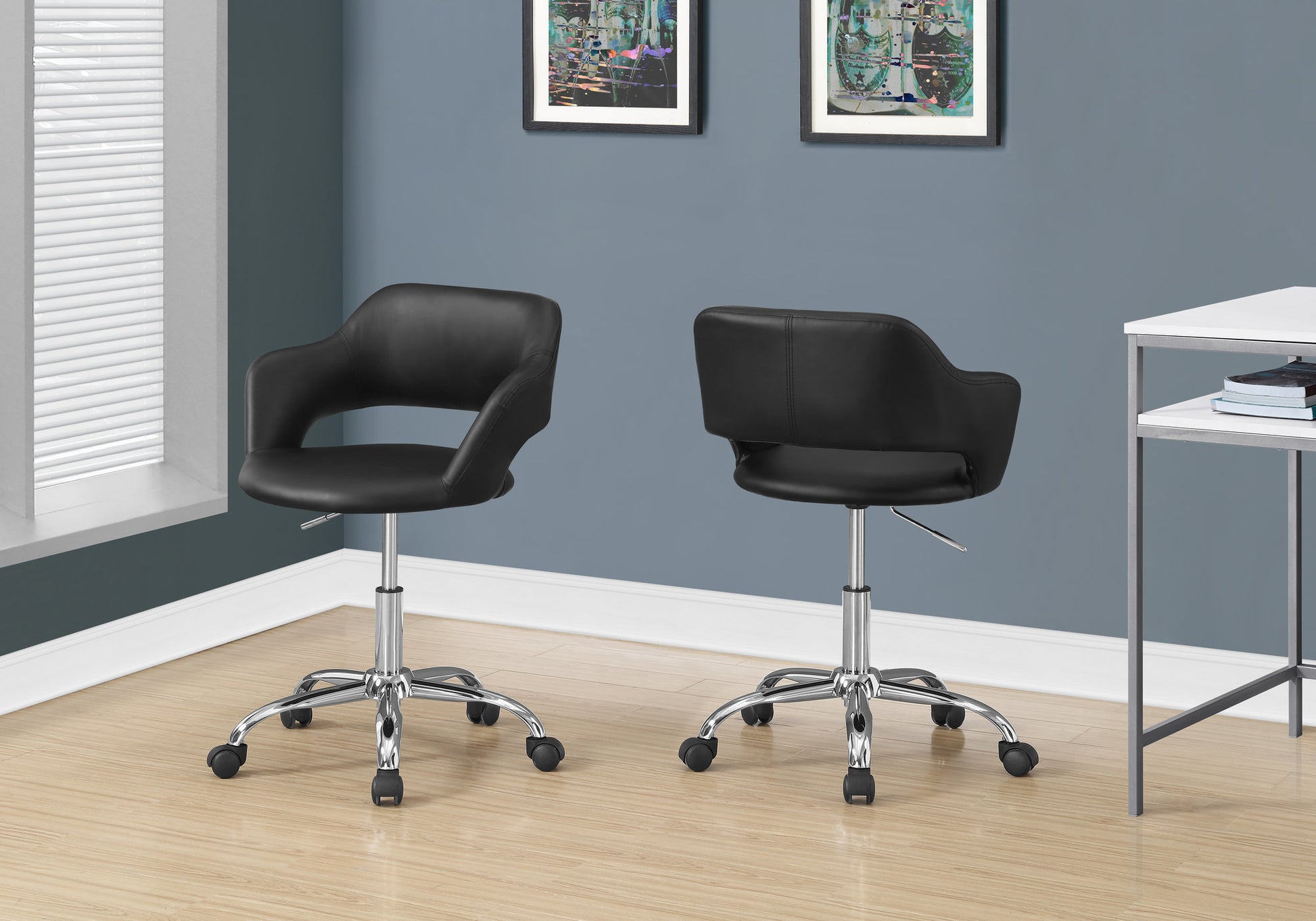 Black leather desk chair with chrome base and casters ideal for home office setups