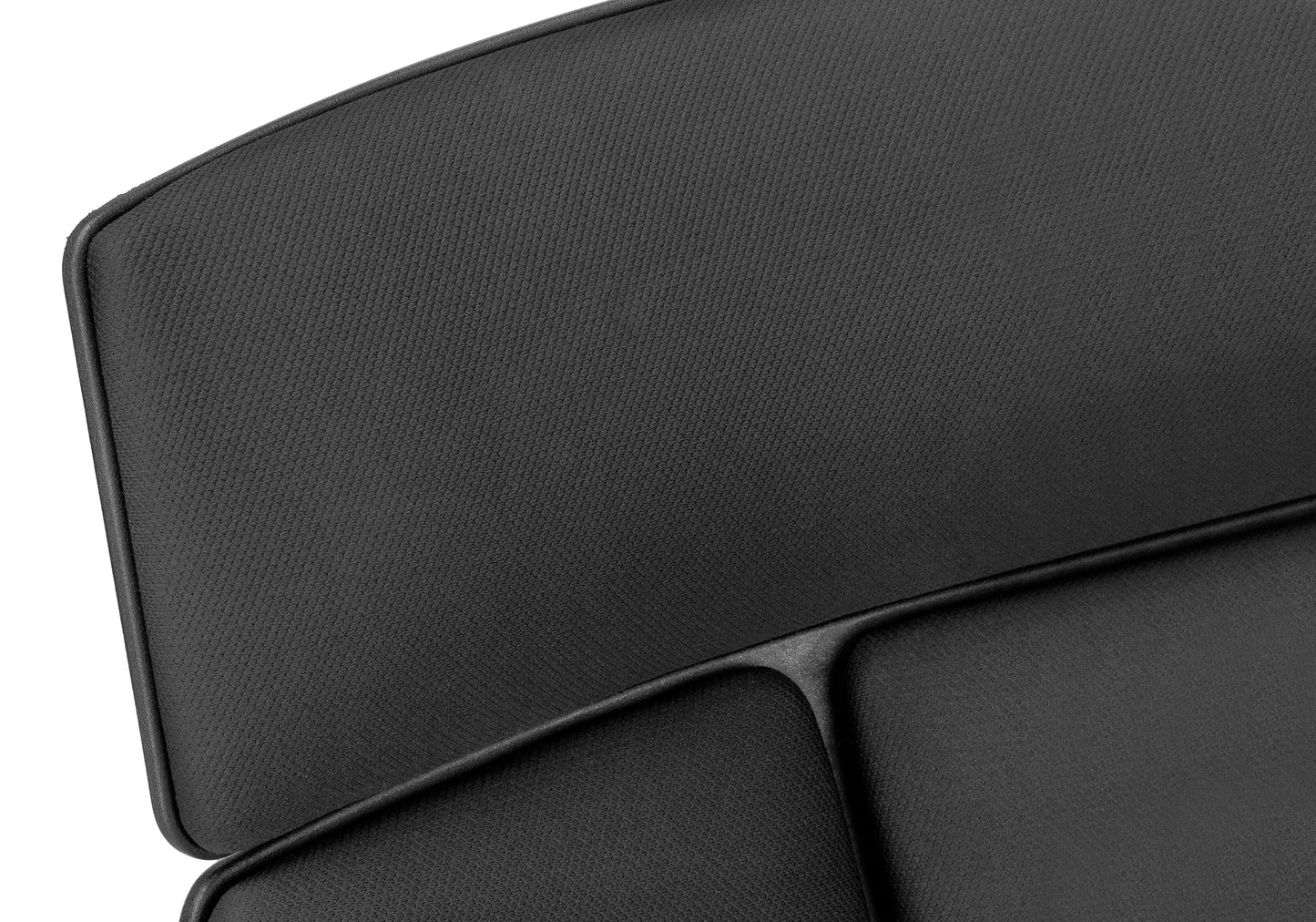 Black office chair headrest with textured fabric detailing