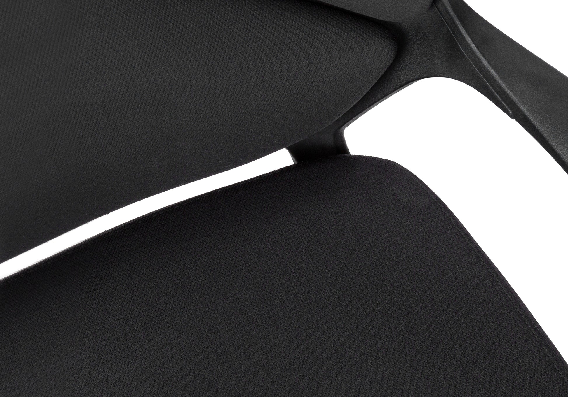 Closeup of black fabric on modern ergonomic office chair seat