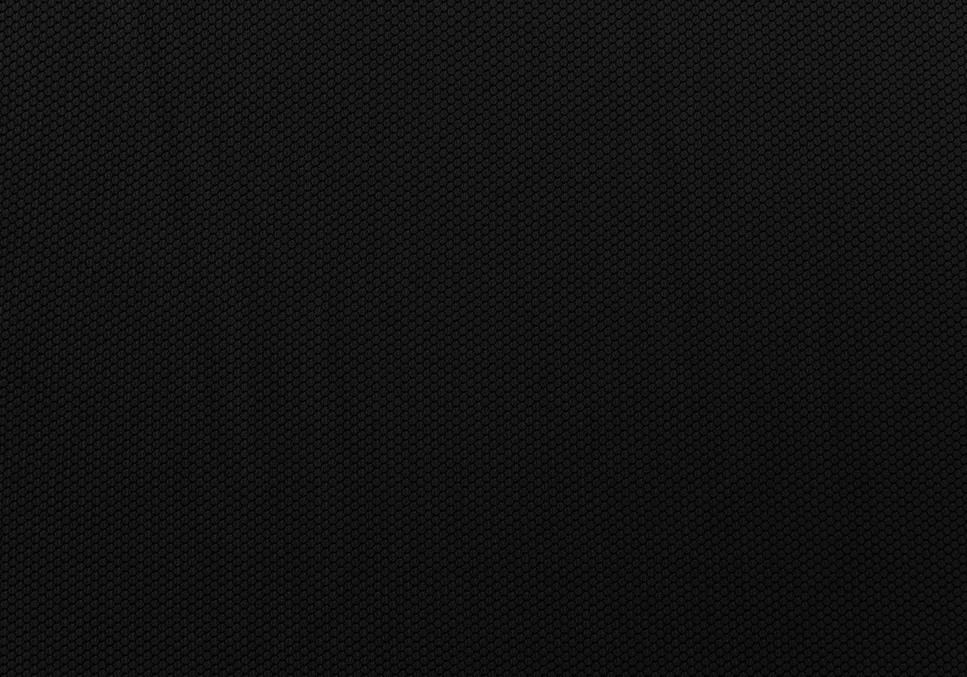 Textured black fabric with a subtle hexagonal weave ideal for breathable athletic wear