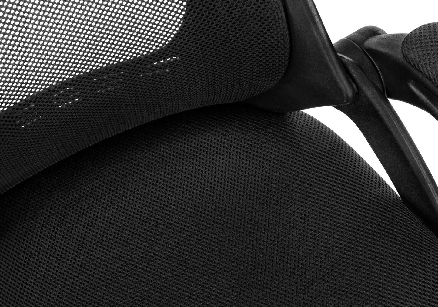 Closeup of black mesh fabric on an office chair backrest