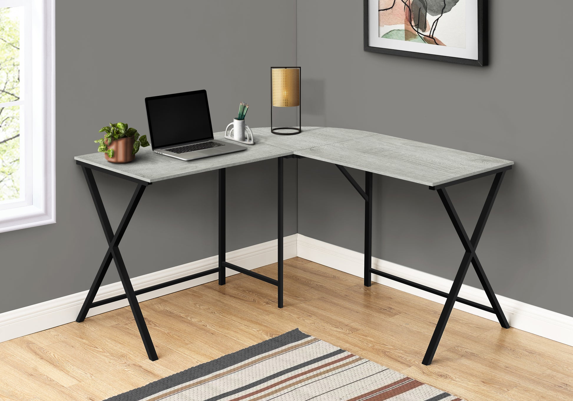 Modern grey wood grain Lshaped desk with black metal Xframe legs ideal for home office use