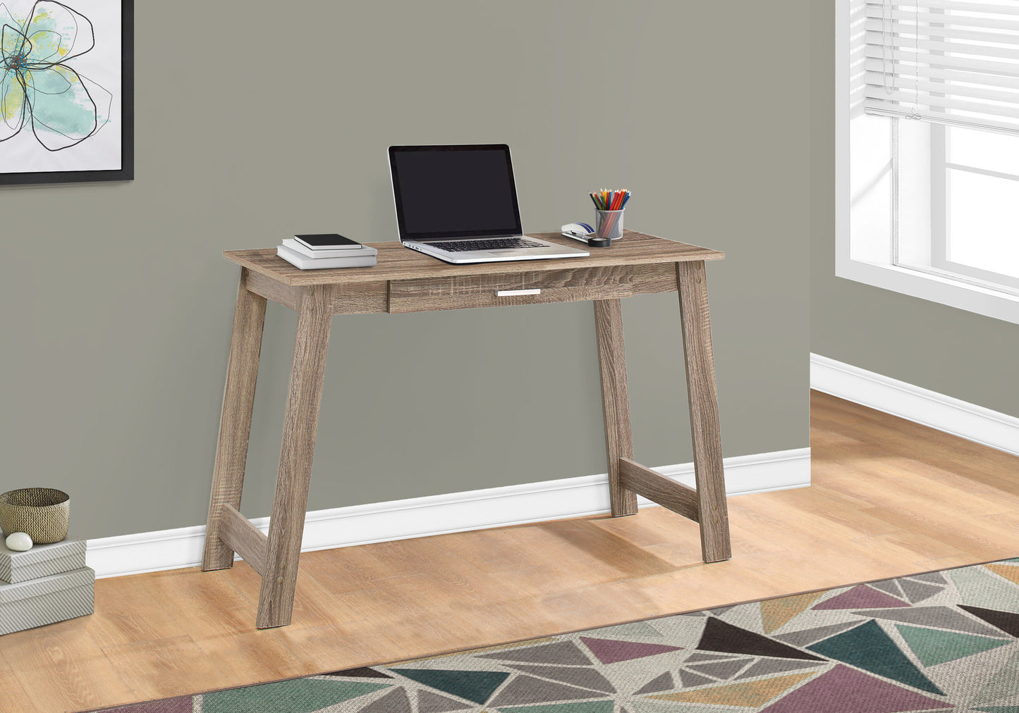 Modern rustic oak writing desk with laptop and art supplies