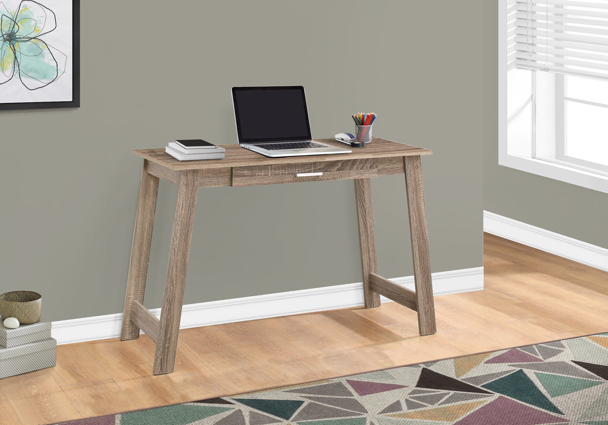 Modern rustic oak writing desk with laptop and art supplies