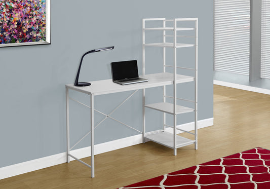 White metal study desk with integrated shelving unit holding a laptop
