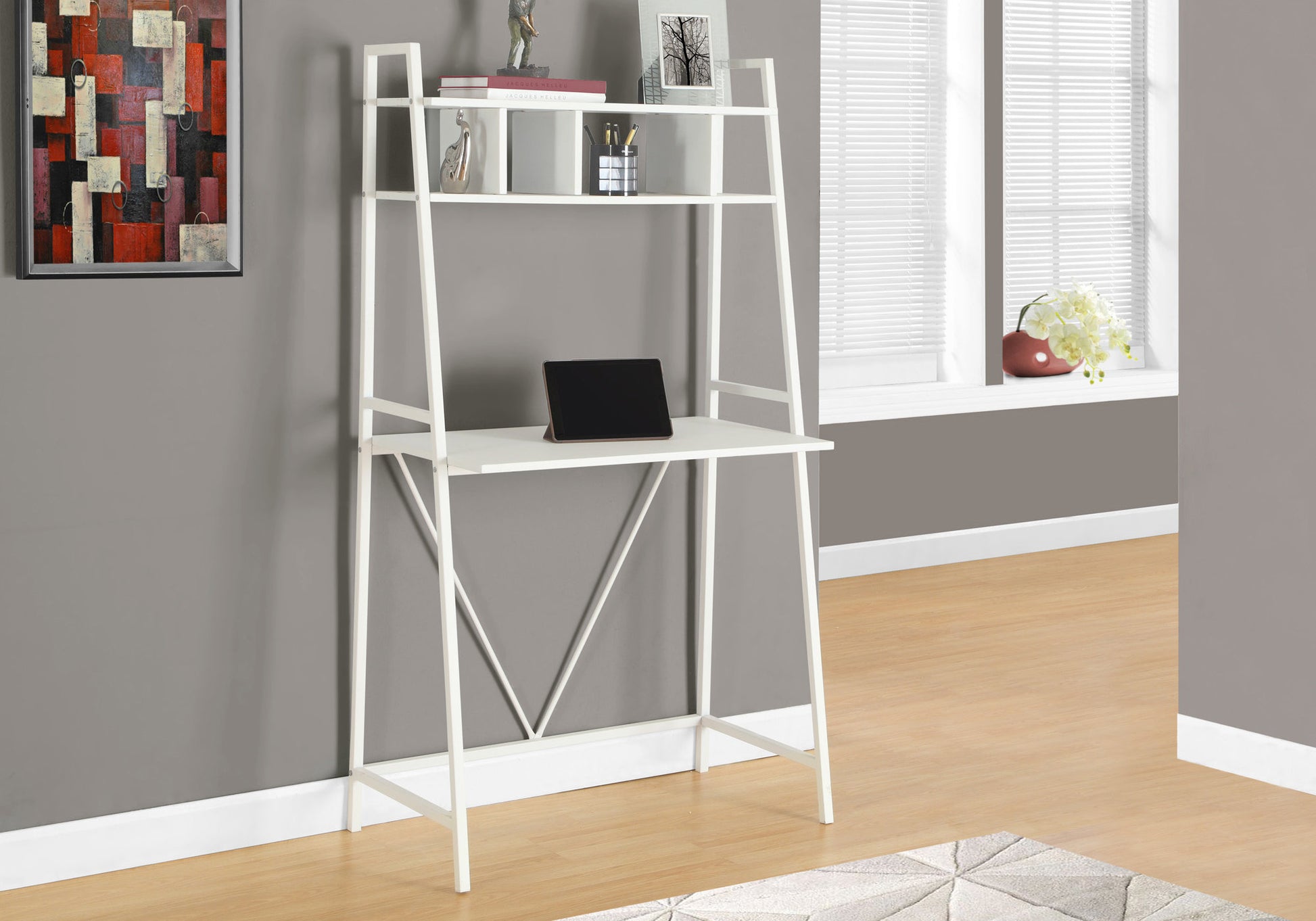 Modern white ladder desk with integrated shelves and a tablet perfect for home office organization