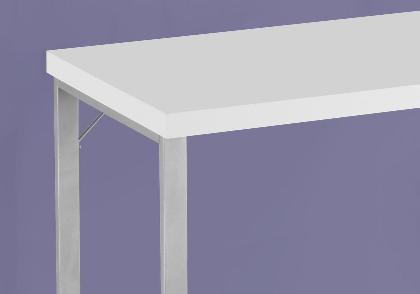 Minimalist white desk with sleek silver metal legs perfect for modern home offices