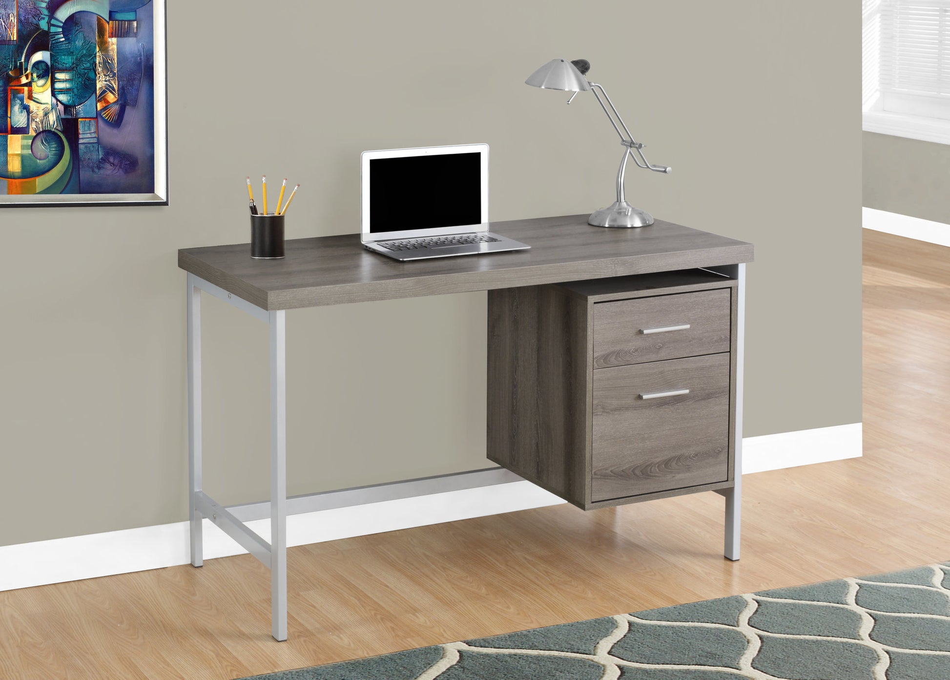 Rustic gray wood desk with silver legs and two drawers for home office storage