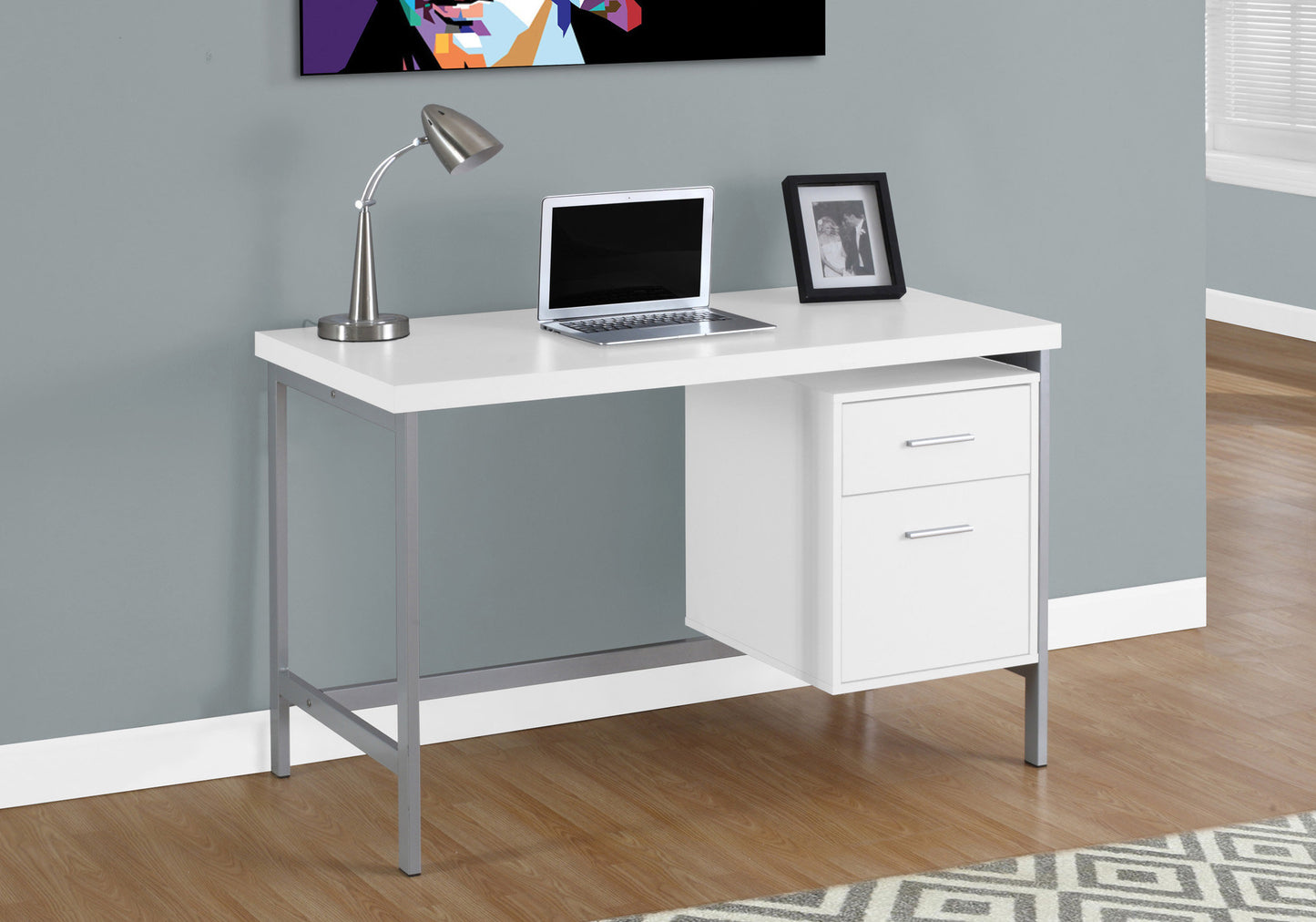 Modern white computer desk with silver metal frame and two drawers for home office use