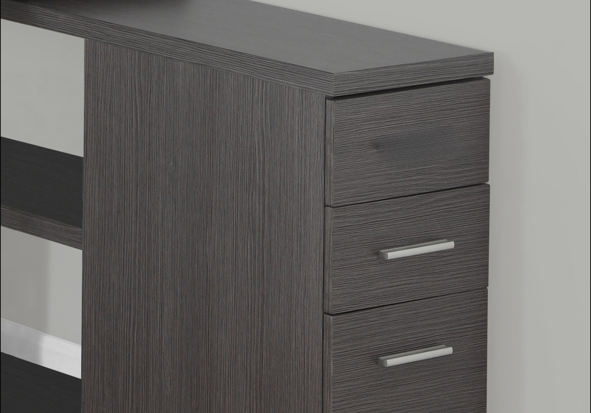 Dark grey modern bookshelf with three drawers and silver hardware