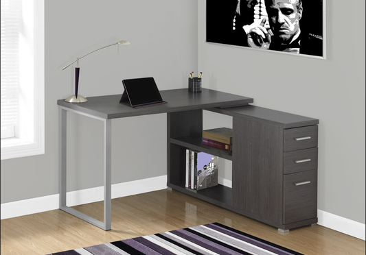 Lshaped corner desk with a dark grey wood grain finish and silver metal legs