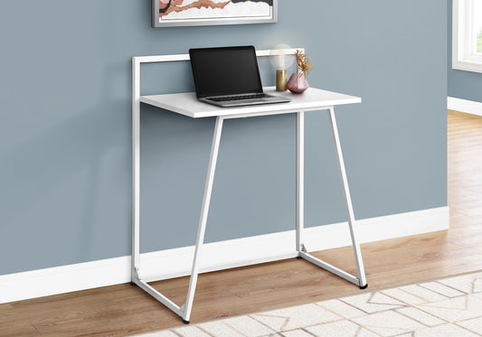 Minimalist white metal frame computer desk with a laptop