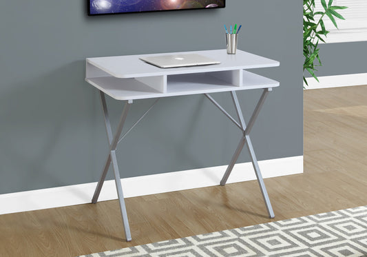 Modern white desk with silver Xframe legs and a laptop