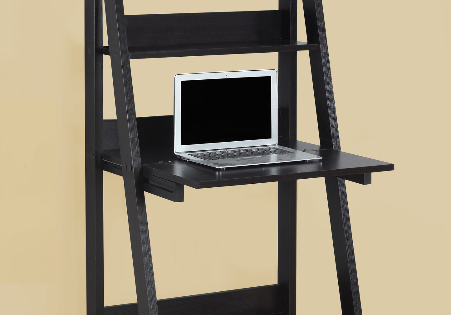 Black ladder desk with open shelving and a laptop for a modern workspace setup