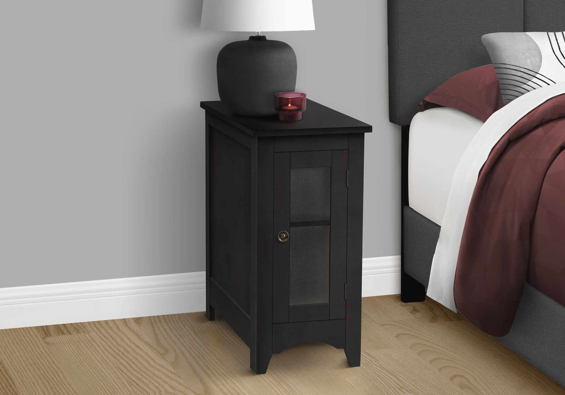 Black accent cabinet with metal mesh door and single drawer