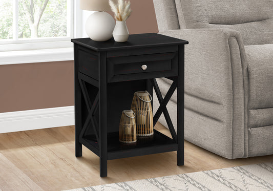 Black wood end table with drawer and open shelf featuring crossleg design