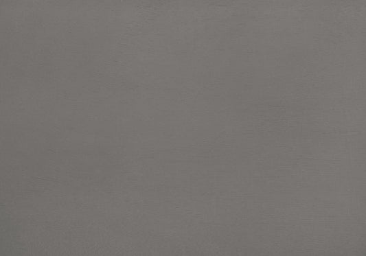 Closeup of textured matte gray paint on a smooth surface