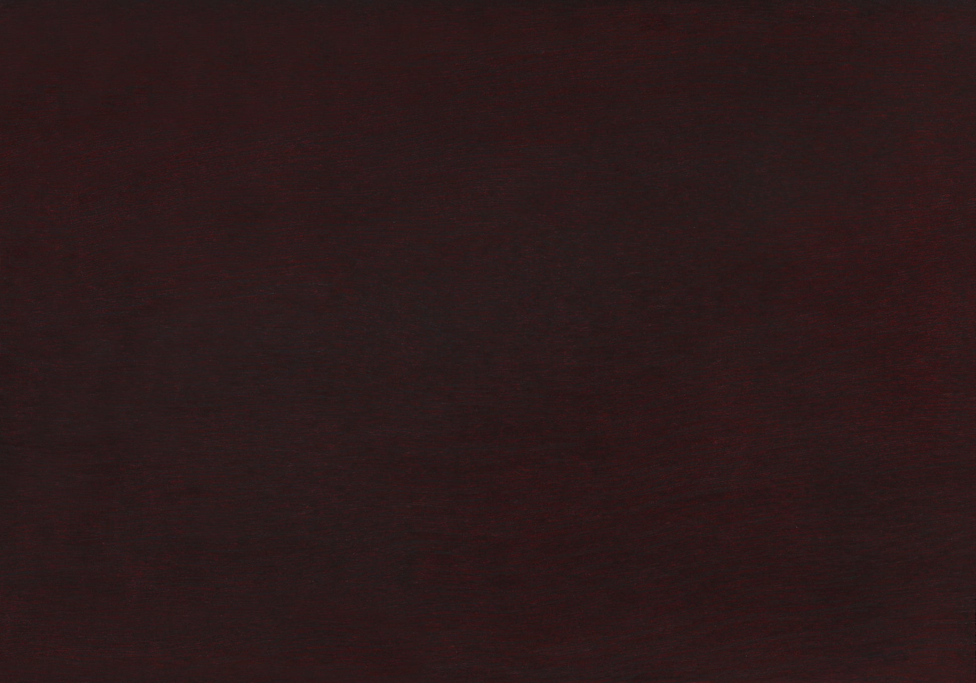 Deep burgundy textured fabric with subtle sheen ideal for upholstery