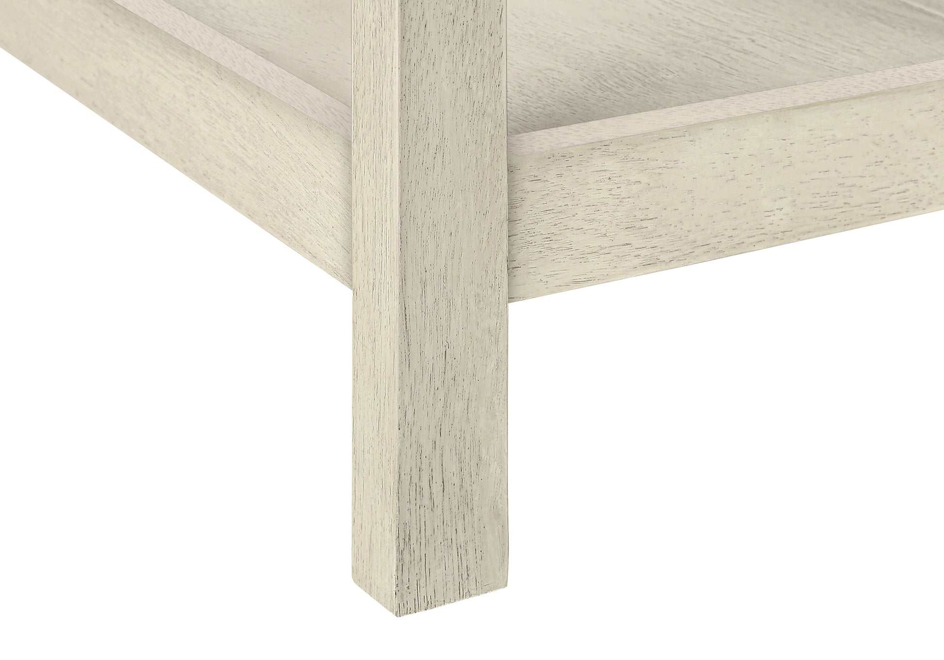Distressed cream wood furniture leg detail with visible grain texture