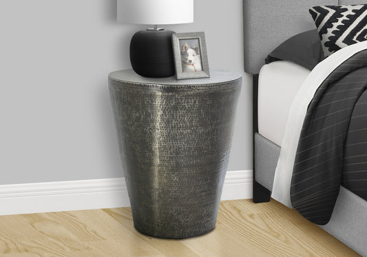 Hammered gunmetal accent table with a conical design