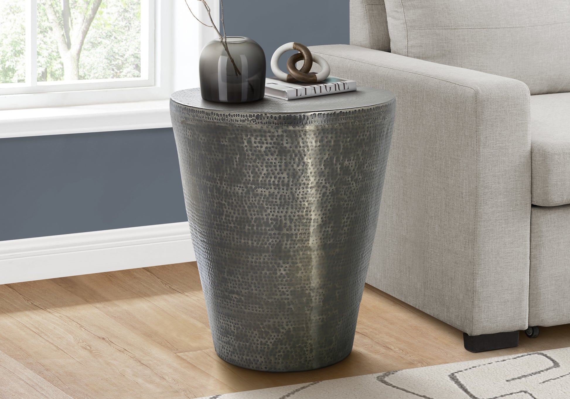 Textured metal drum side table with hammered finish gunmetal gray
