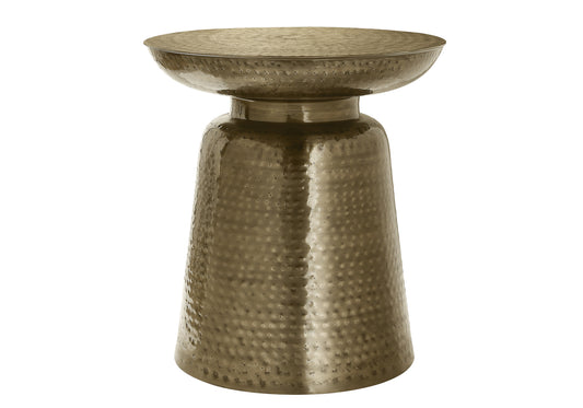 Hammered bronze accent table with a textured pedestal base and wide top surface