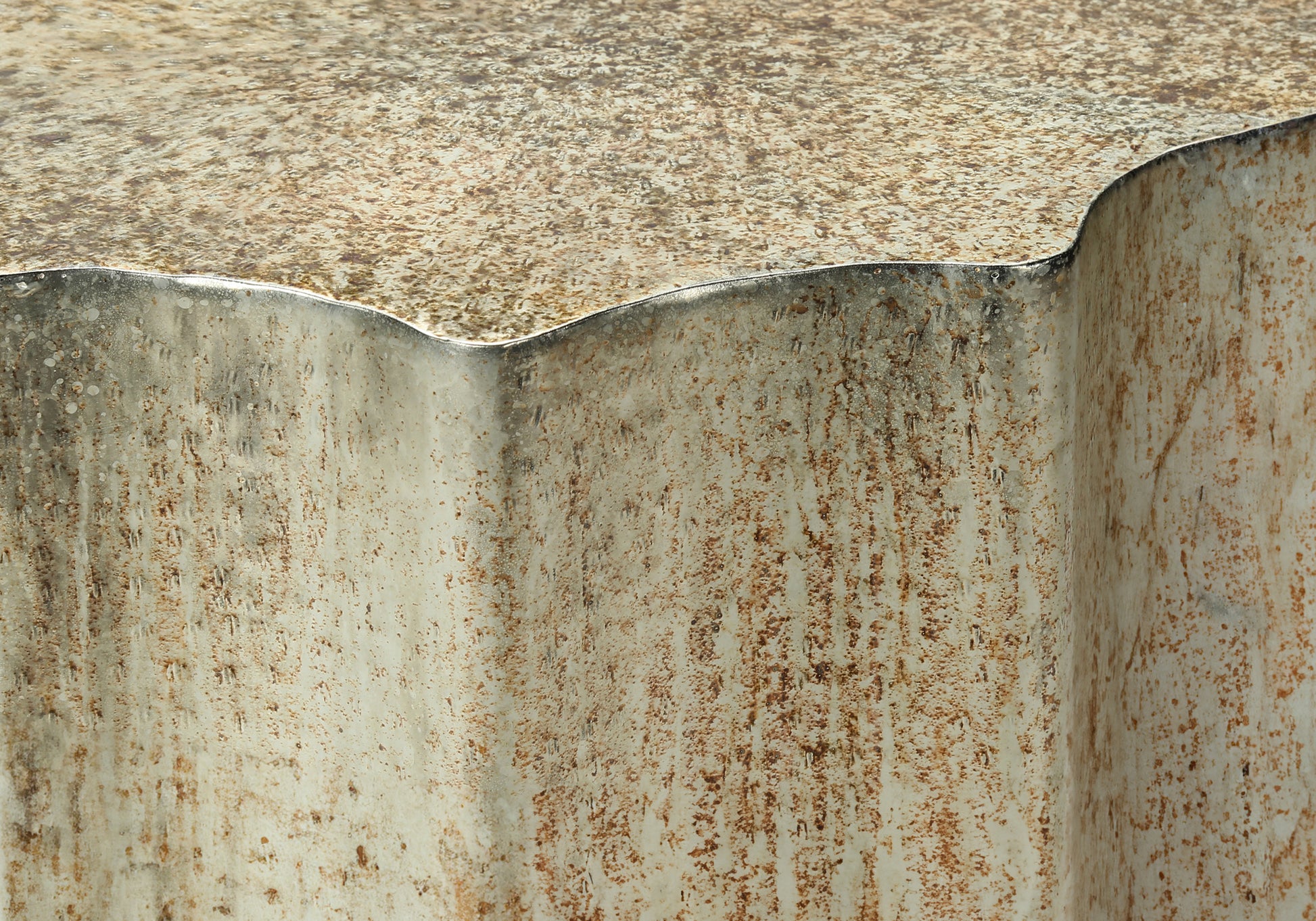 Abstract textured surface with distressed beige and rust tones evoking industrial charm
