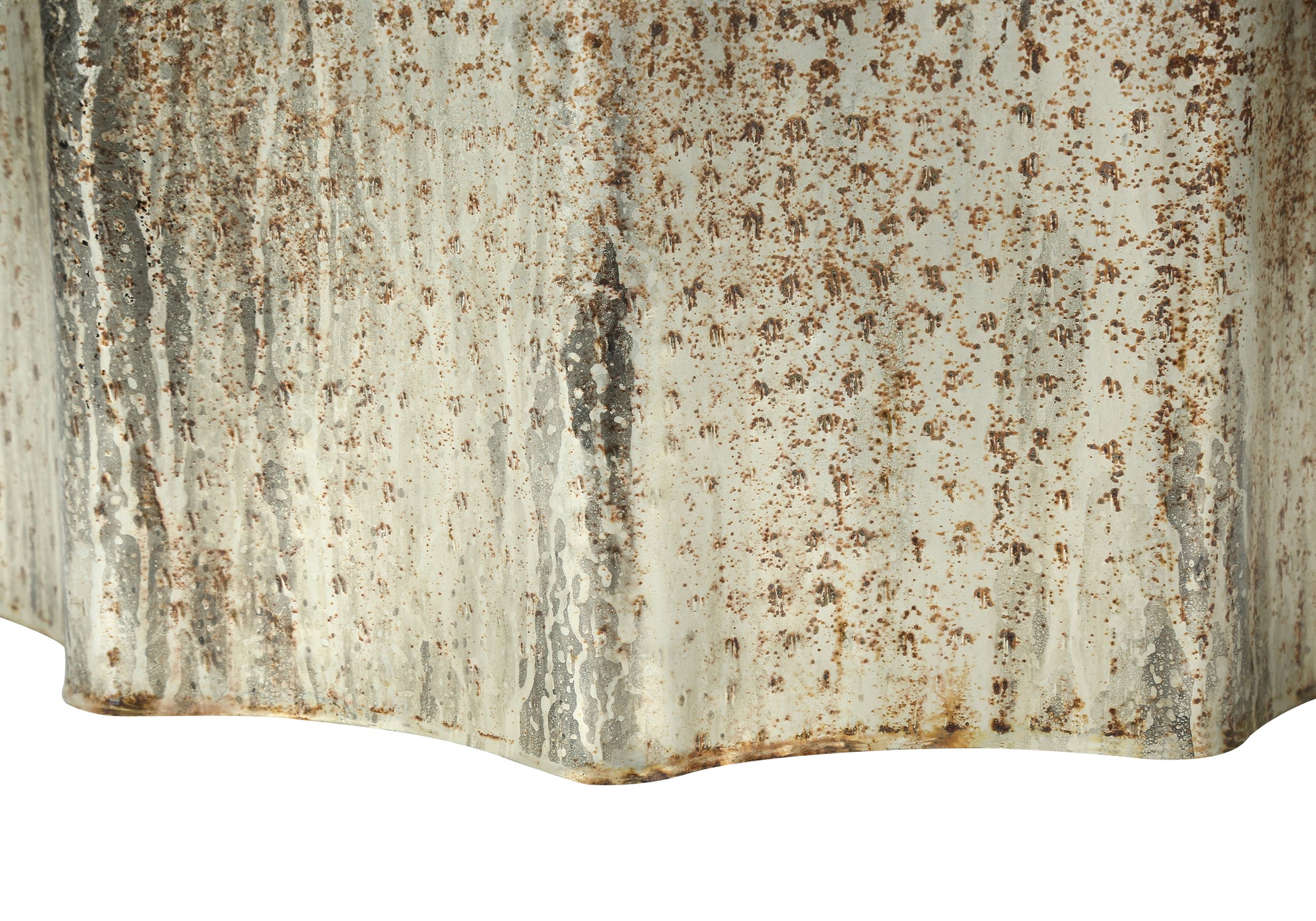 Distressed galvanized metal bucket with textured rust patterns