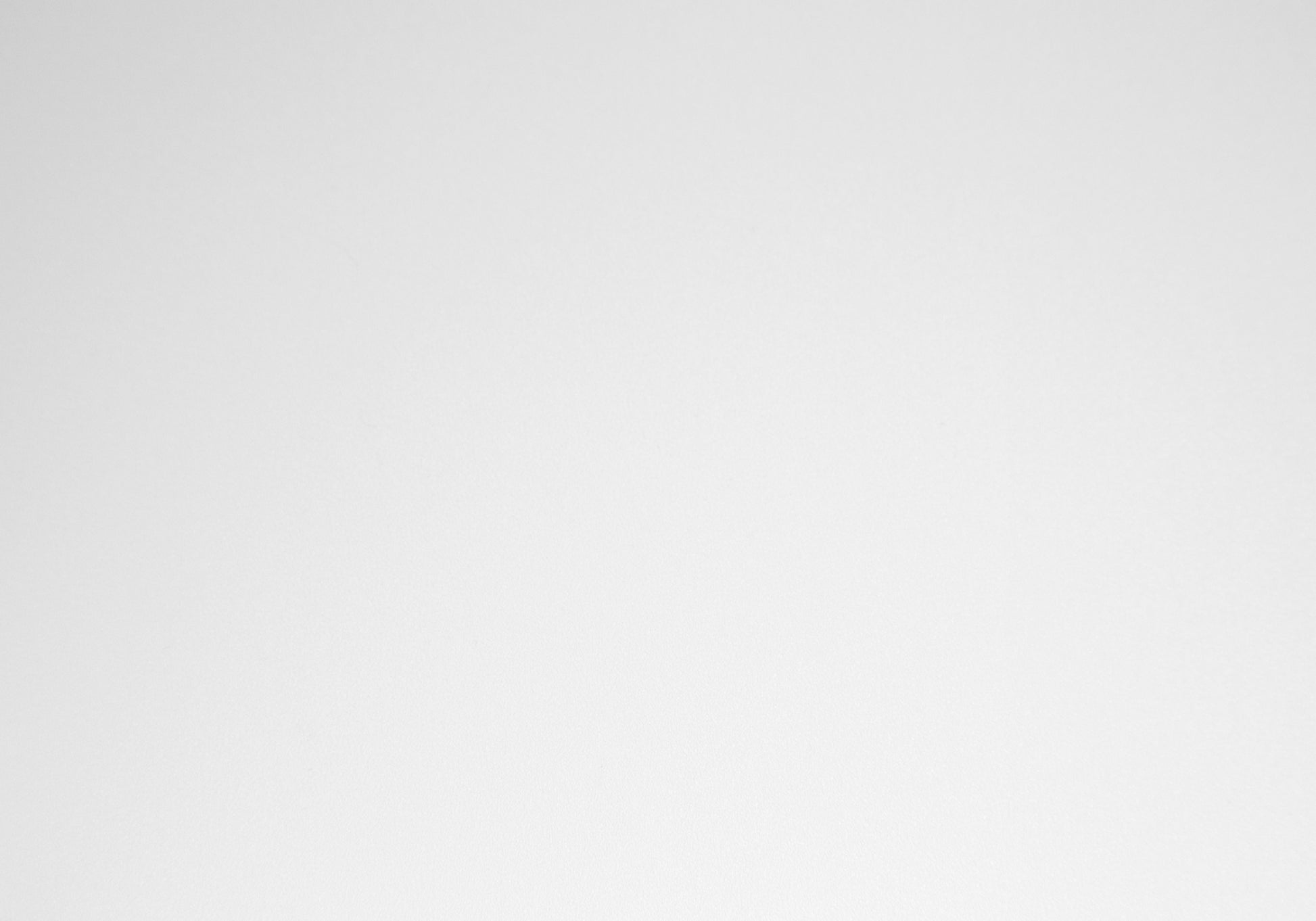 Minimalist white ceramic coffee mug with a comfortable handle for daily use