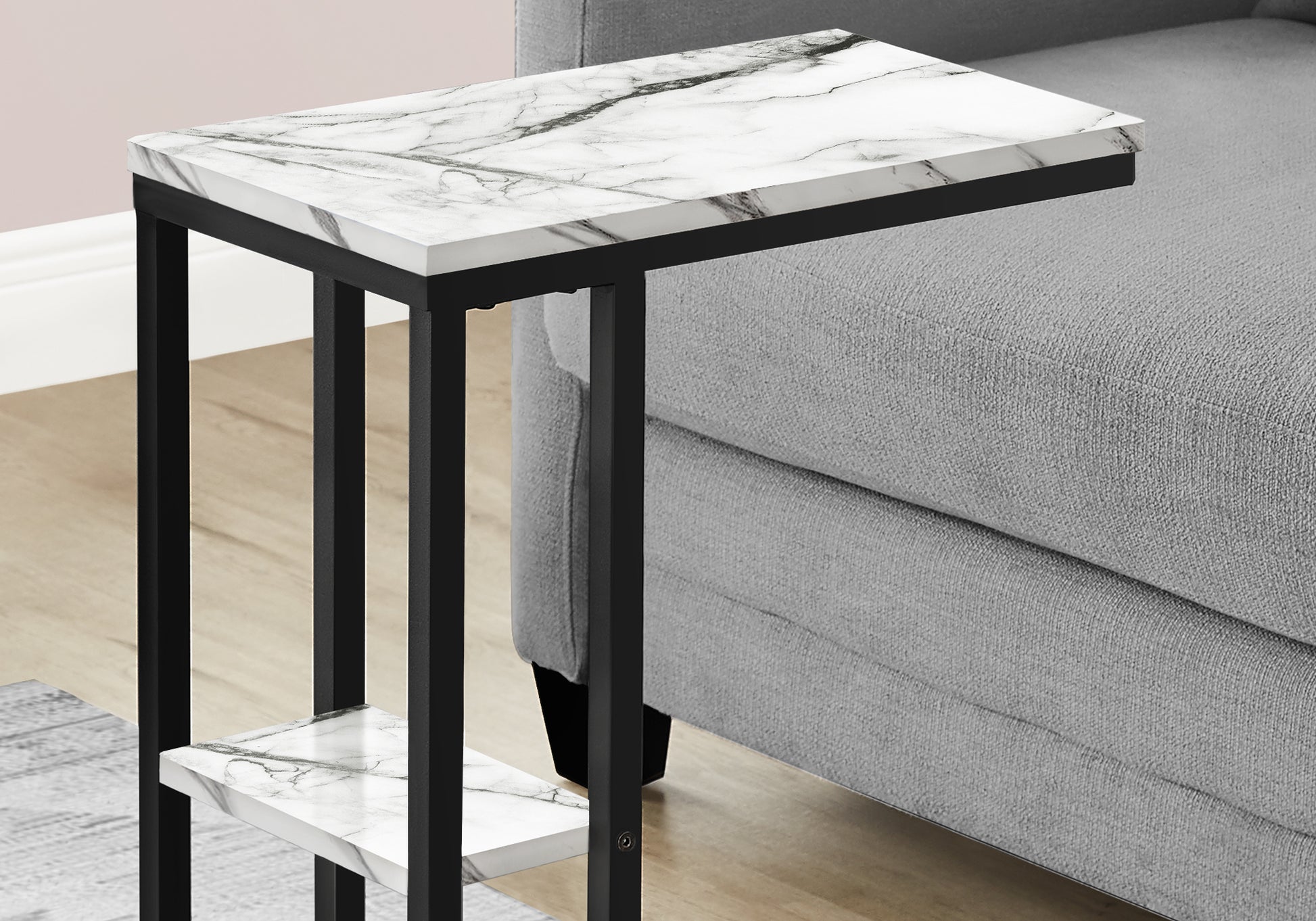 Compact marble Ctable with black metal frame perfect for small spaces