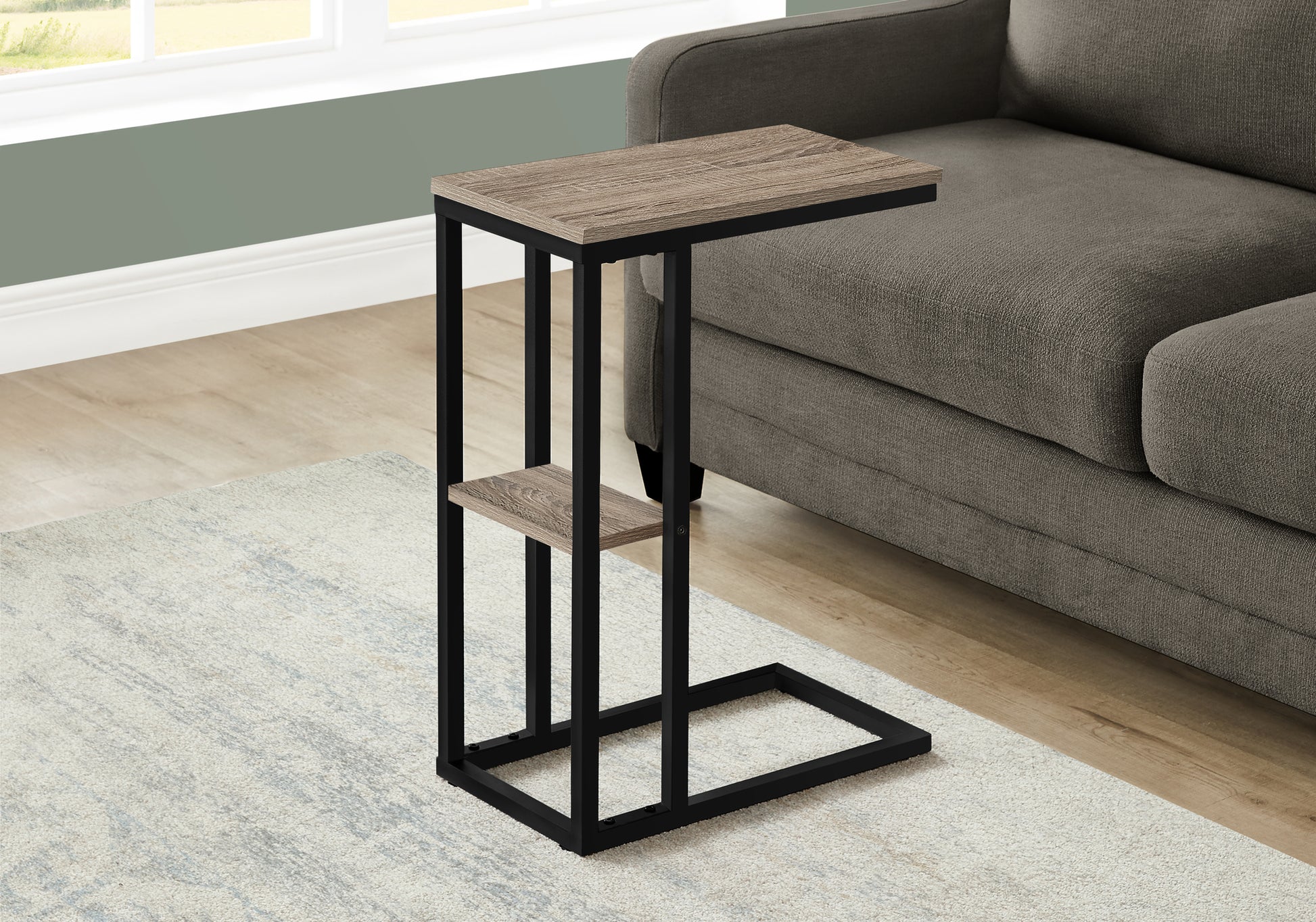 Cshaped side table with weathered oak finish and black metal frame perfect for sofa use
