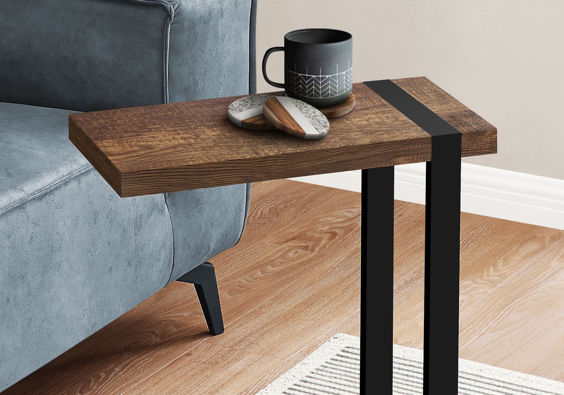 Ctable with rustic wood grain top and black metal legs perfect for sofa side use